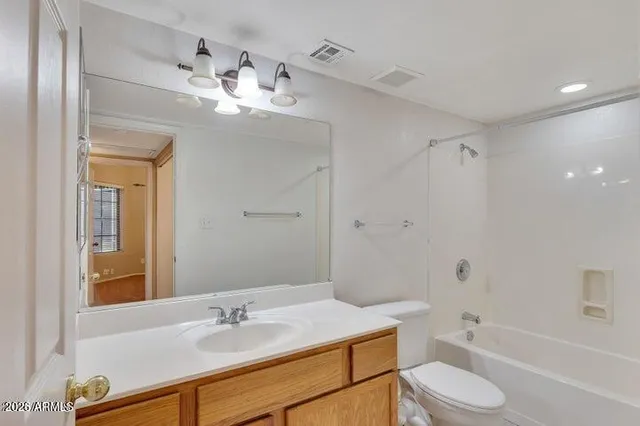 a bathroom with a sink toilet tub and shower