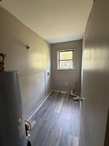a view of room with window and hardwood floor