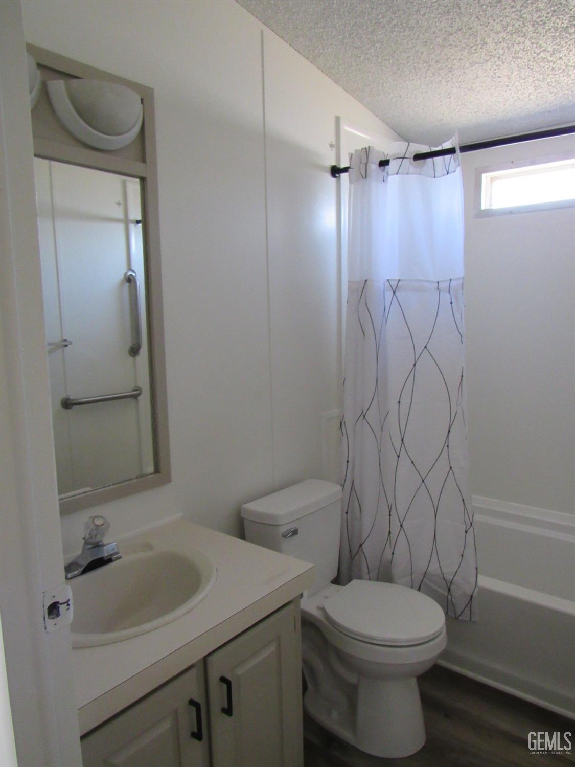 Undisclosed Address Bakersfield, CA 93304 - Photo 16 of 26 a bathroom with a sink toilet and shower