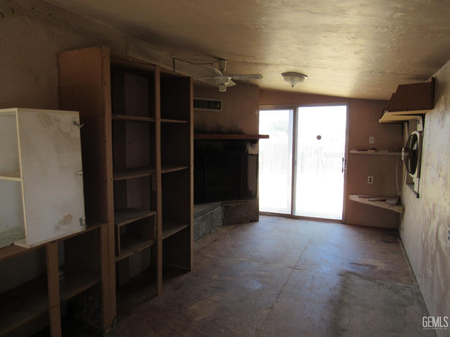 Undisclosed Address Bakersfield, CA 93304 - Photo 19 of 26 a view of walk in closet with clothes and shoes