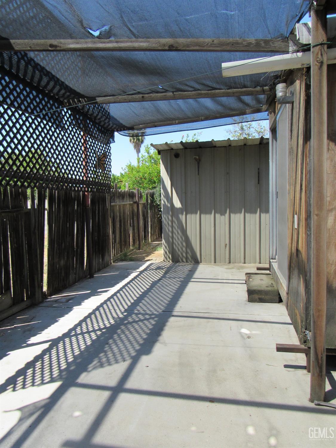 Undisclosed Address Bakersfield, CA 93304 - Photo 25 of 26 a white building with a outdoor space