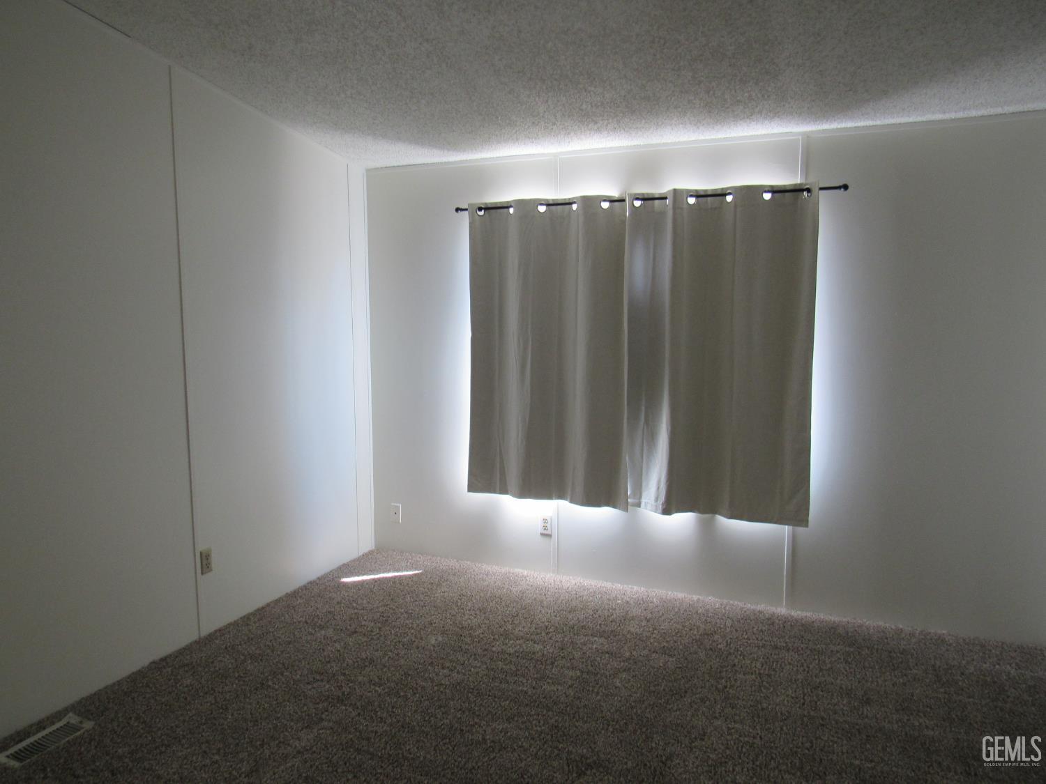 Undisclosed Address Bakersfield, CA 93304 - Photo 8 of 26 a view of an empty room