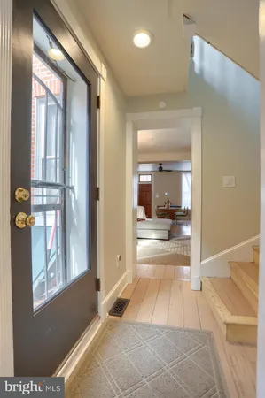 a view of a bathroom with a tub and mirror