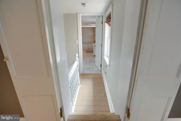 a bathroom with a double vanity sink toilet and shower