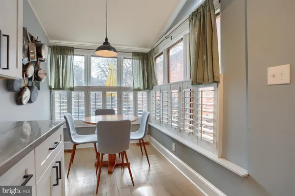 a dining room with furniture window wooden floor