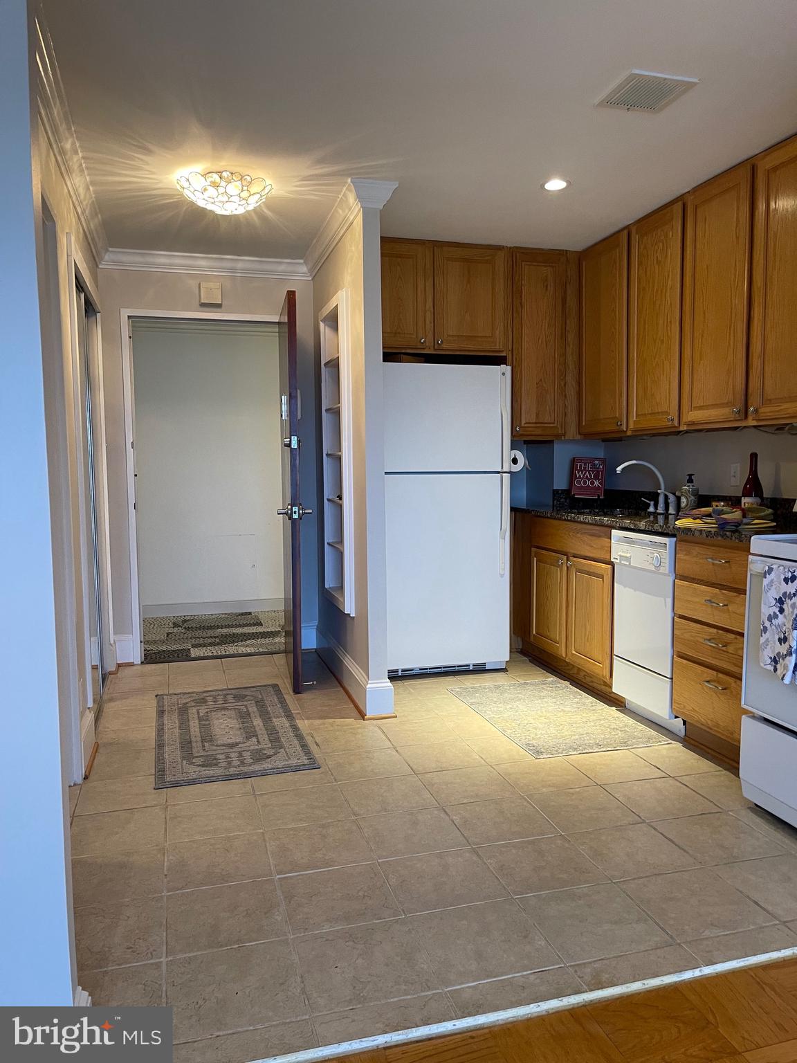 520 N Street Southwest, Unit S618 Washington, DC 20024 - Photo 16 of 62 a kitchen with stainless steel appliances granite countertop a refrigerator and a stove