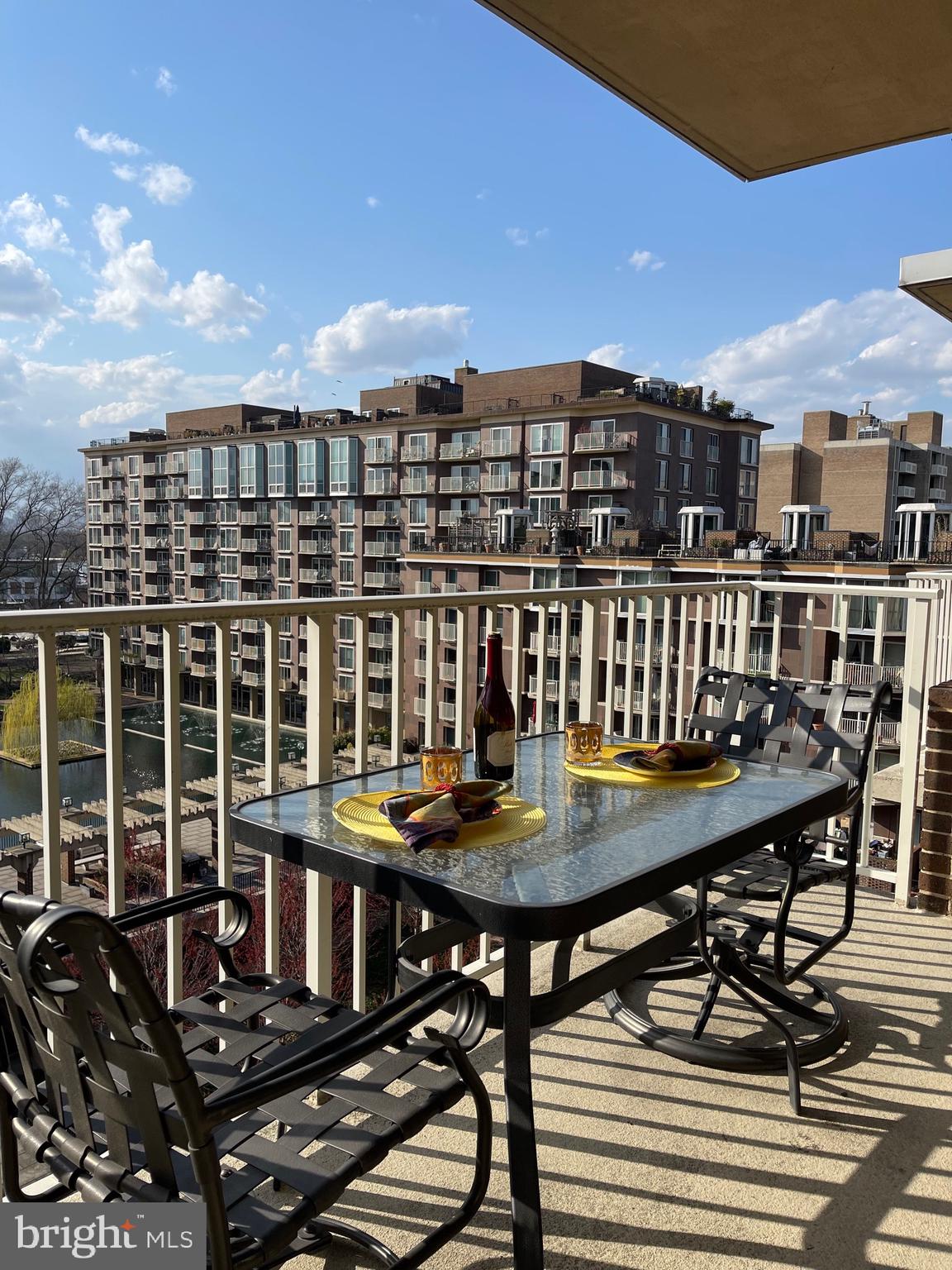 520 N Street Southwest, Unit S618 Washington, DC 20024 - Photo 28 of 62 a view of a chairs and table on the terrace