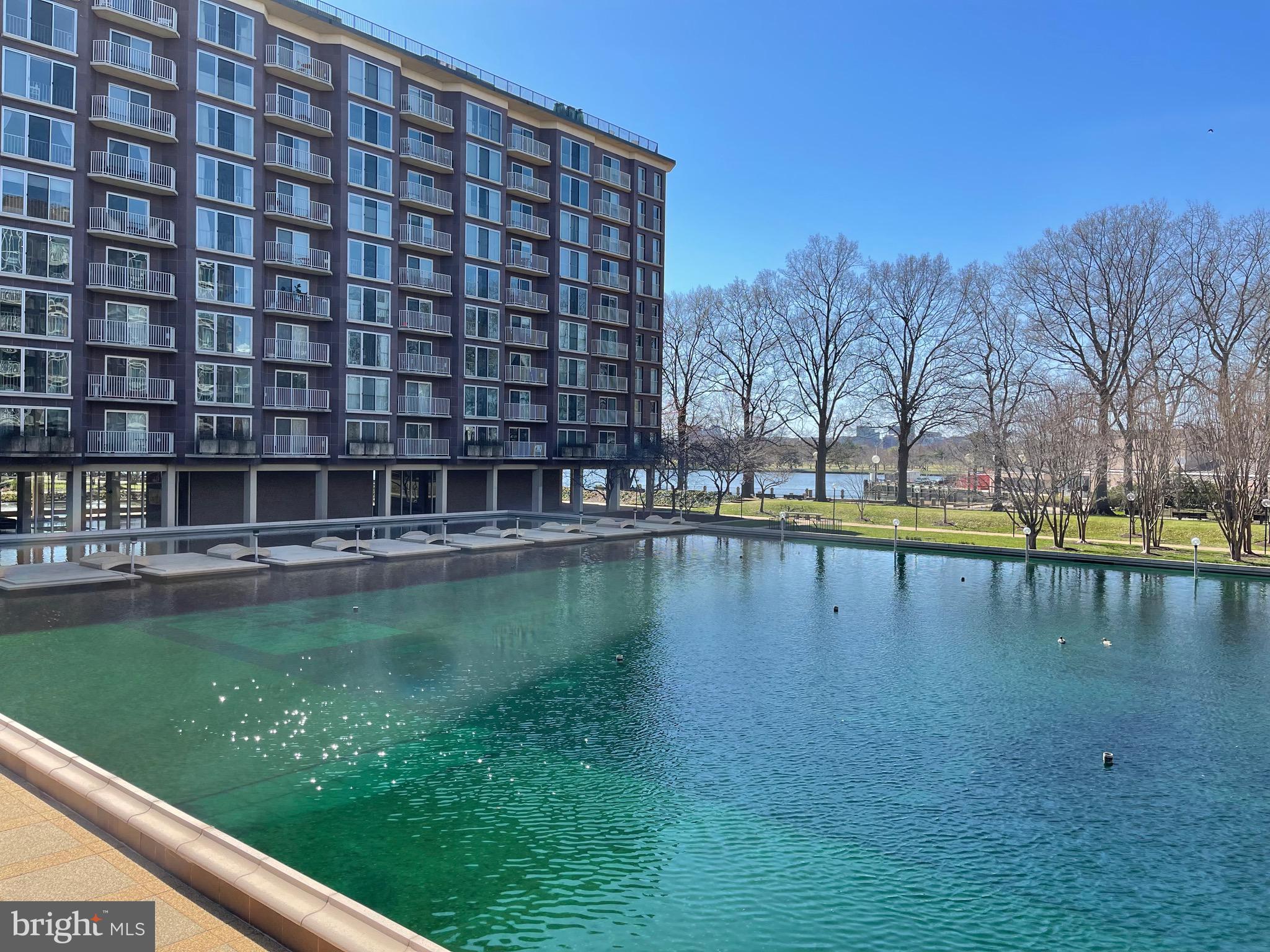 520 N Street Southwest, Unit S618 Washington, DC 20024 - Photo 33 of 62 a view of a swimming pool with outdoor space and seating area