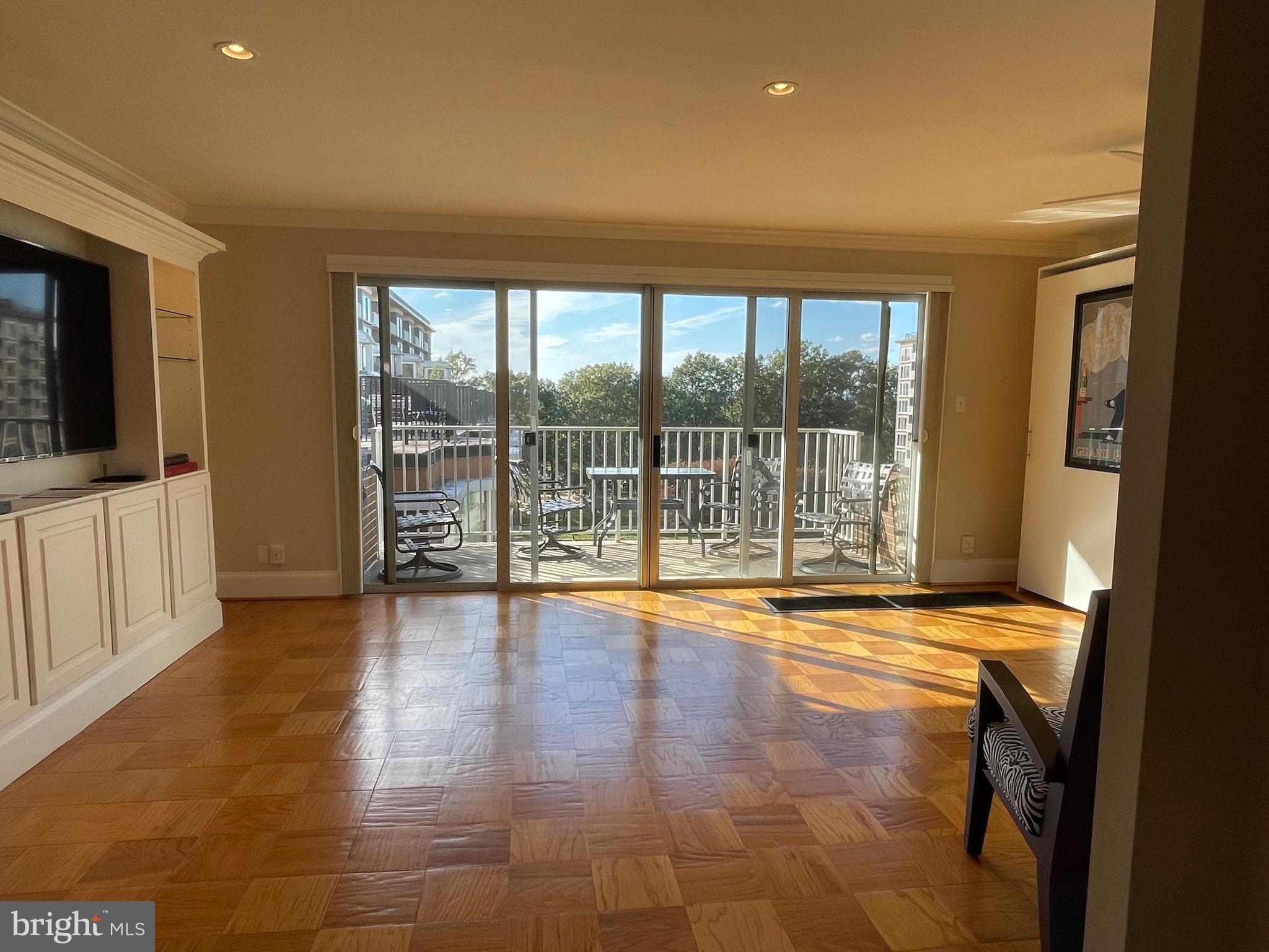 520 N Street Southwest, Unit S618 Washington, DC 20024 - Photo 7 of 62 a view of empty room with wooden floor and fan