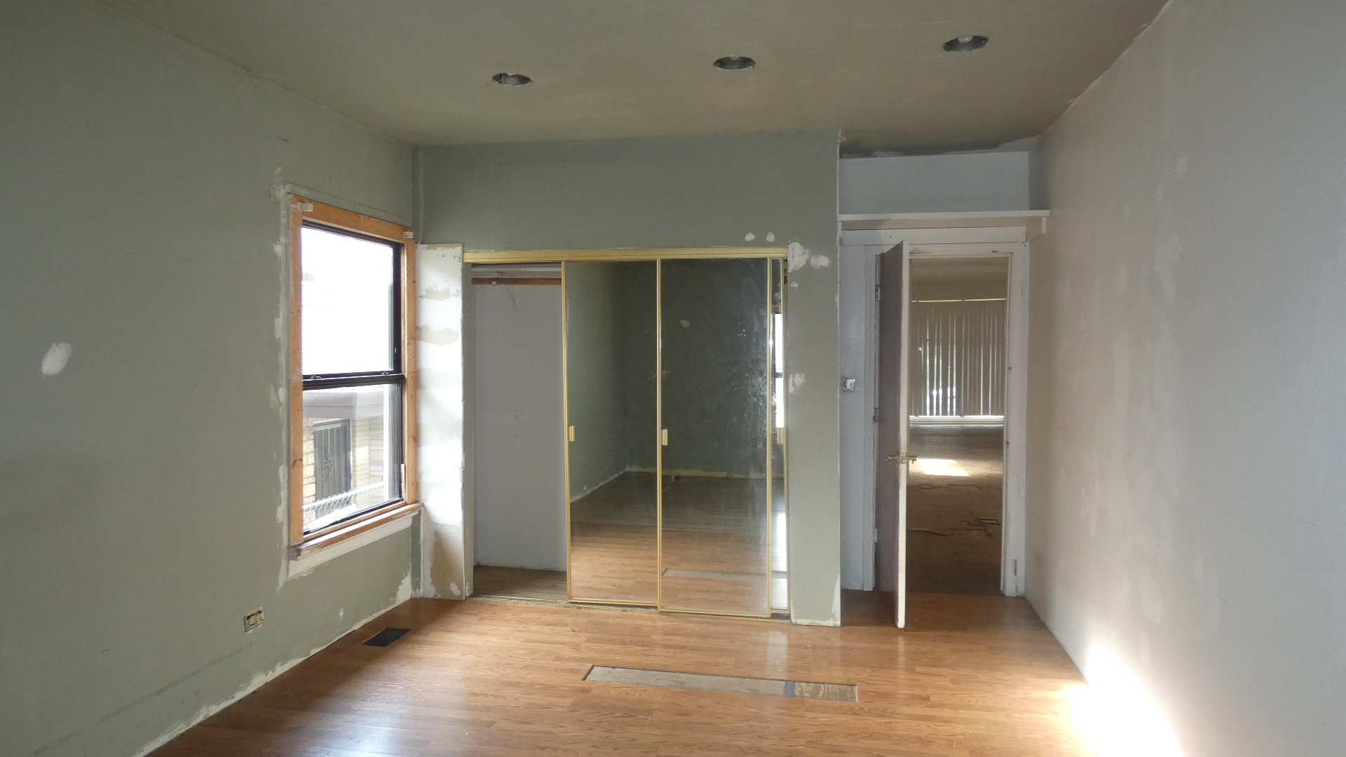 1707 East 83rd Street Chicago, IL 60617 - Photo 6 of 15 an empty room with windows and closet