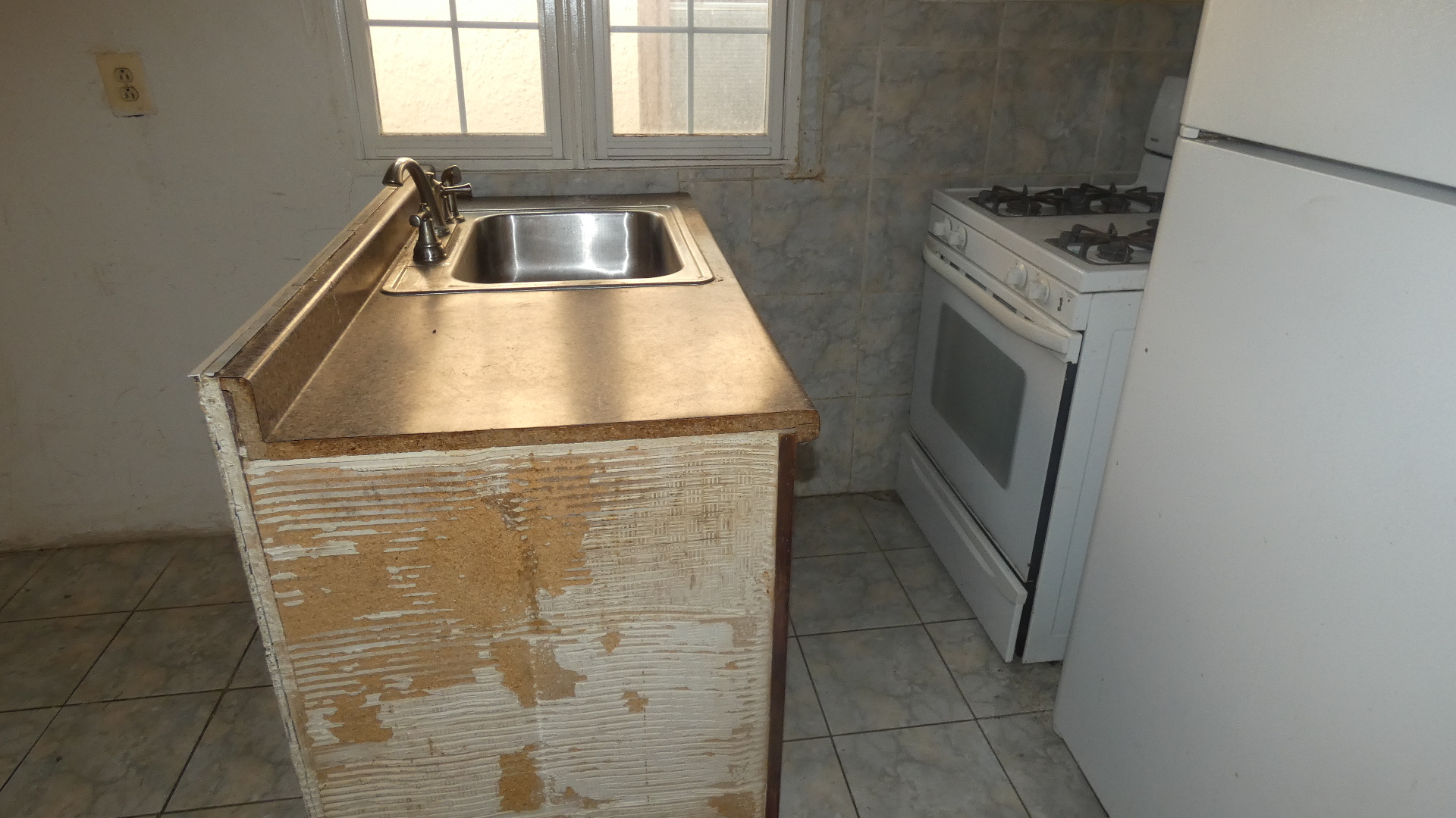 1707 East 83rd Street Chicago, IL 60617 - Photo 8 of 15 a bathroom with a sink and washing machine