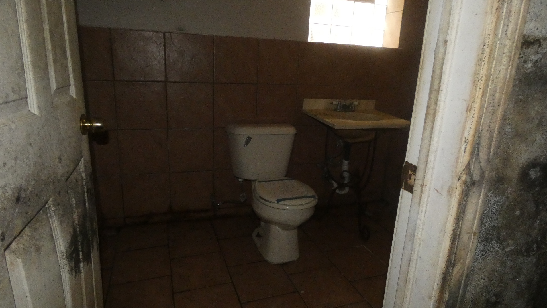 1707 East 83rd Street Chicago, IL 60617 - Photo 10 of 15 a bathroom with a toilet and a sink