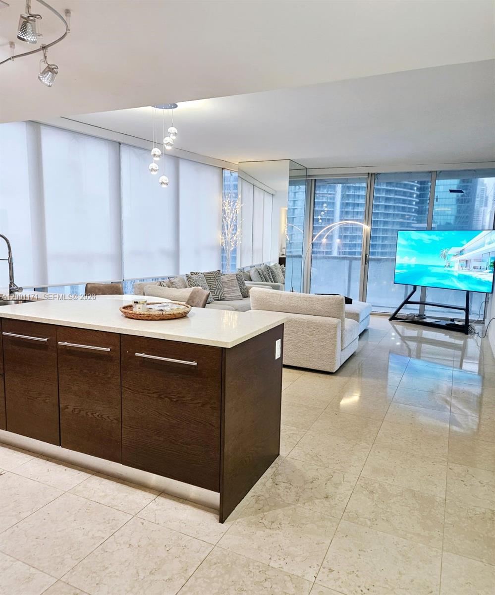 475 Brickell Avenue, Unit 2115 Miami, FL 33131 - Photo 1 of 21 a living room with a sink furniture and a window