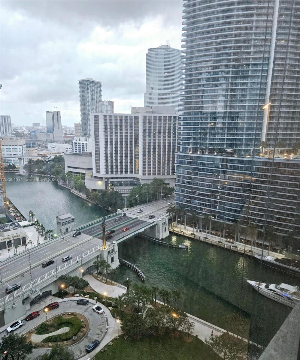 475 Brickell Avenue, Unit 2115 Miami, FL 33131 - Photo 18 of 21 a view of a lake with a yard and a large window