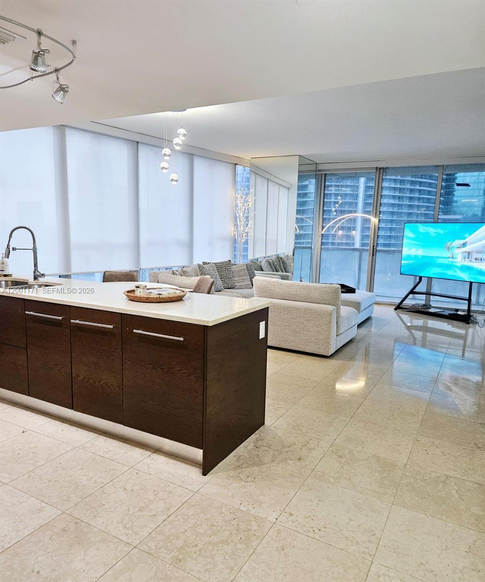 475 Brickell Avenue, Unit 2115 Miami, FL 33131 - Photo 4 of 21 a living room with stainless steel appliances kitchen island granite countertop a sink and a stove top oven