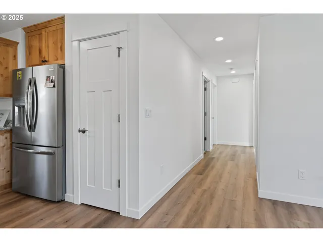 a view of kitchen space with wooden floor