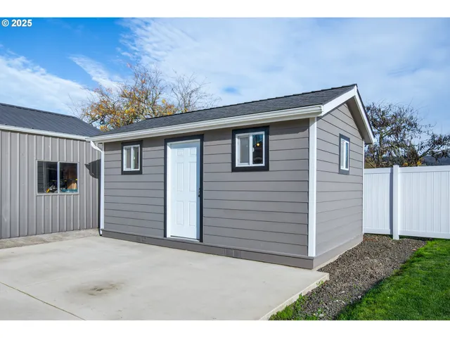 an empty room with wooden floor and closet