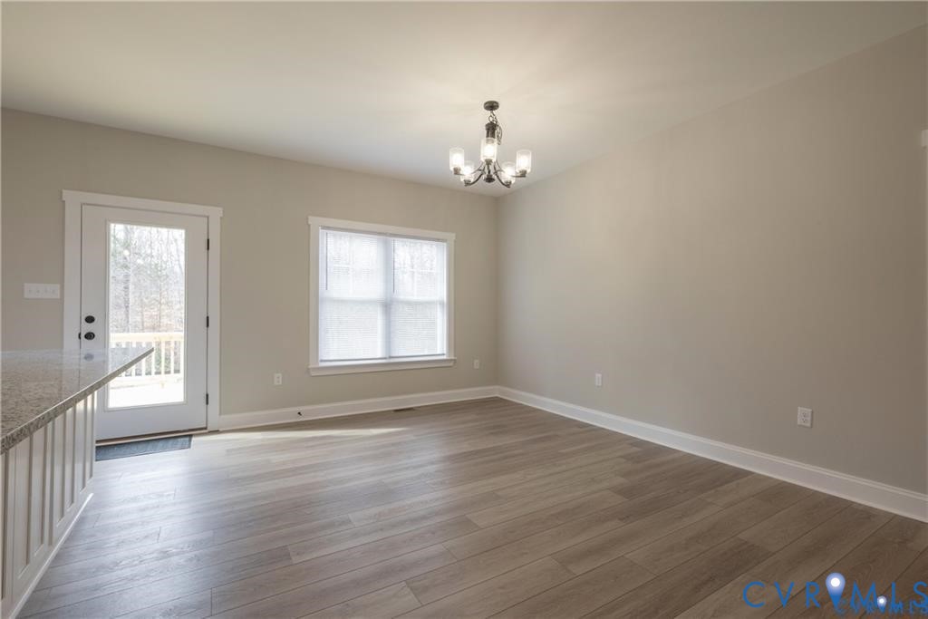 2223 Ridge Road Arvonia, VA 23004 - Photo 12 of 32 Spacious room featuring wood-finish flooring, a co