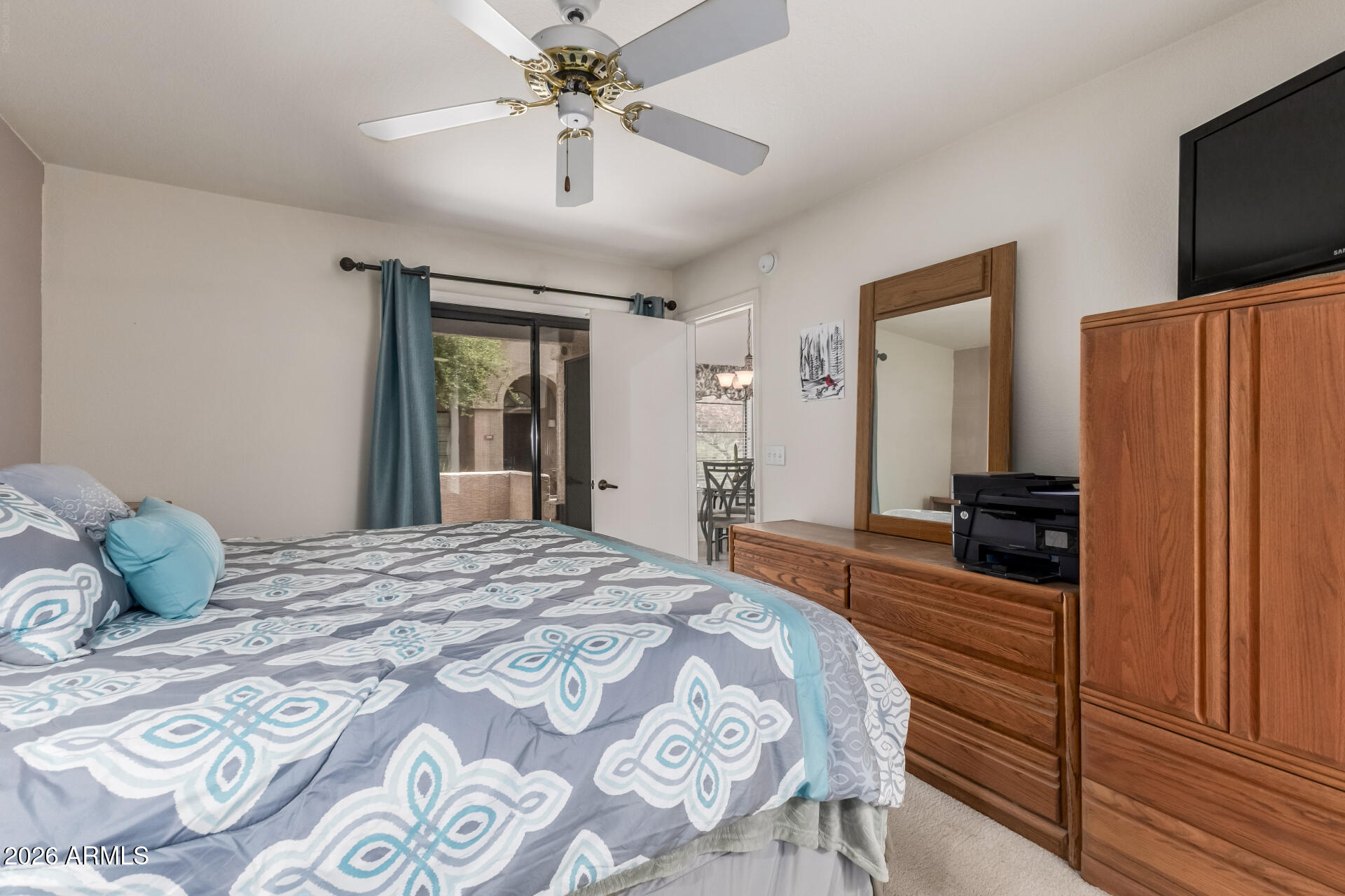 14300 West Bell Road, Unit 311 Surprise, AZ 85374 - Photo 13 of 50 a bedroom with a bed and a television