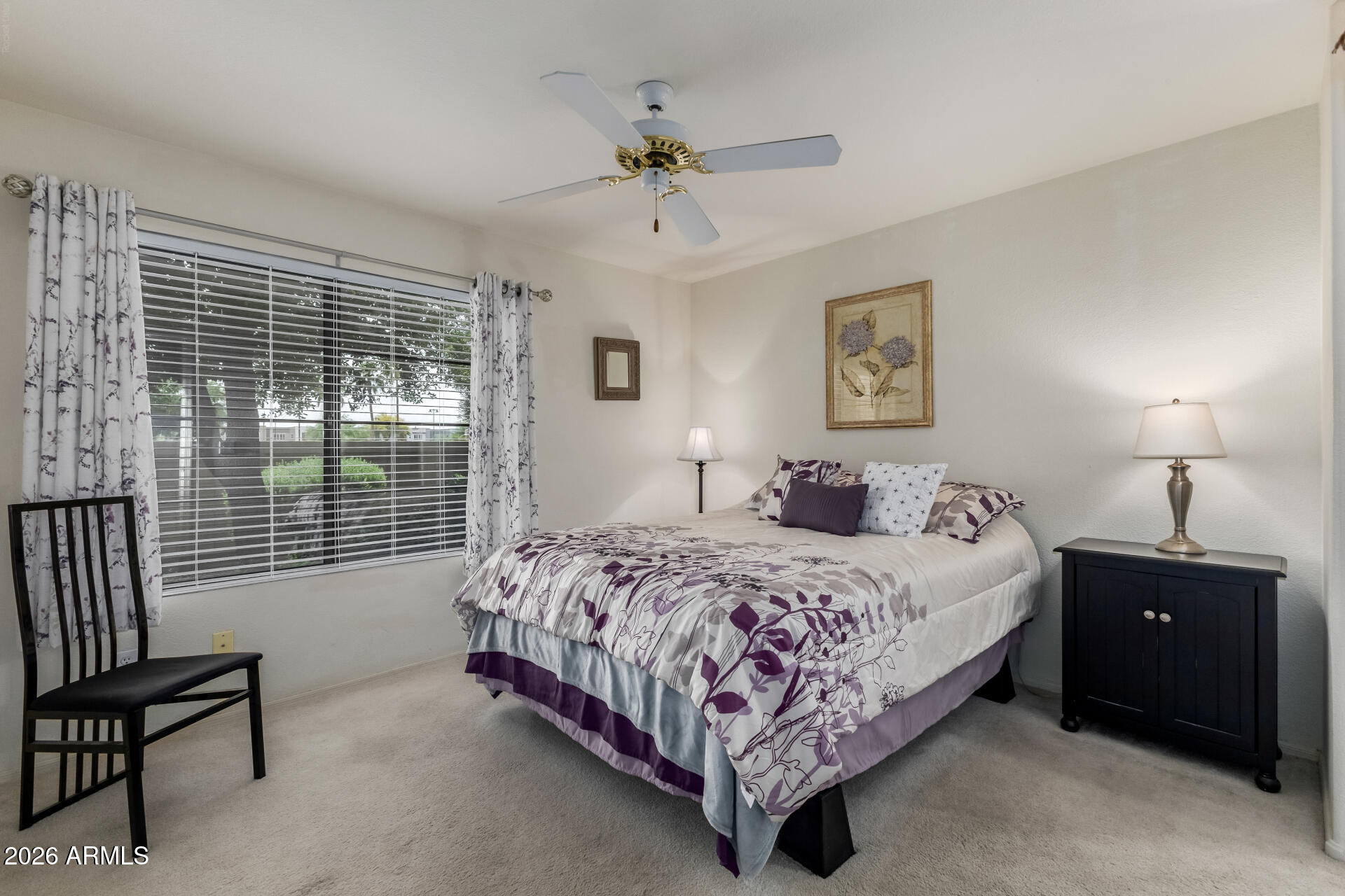 14300 West Bell Road, Unit 311 Surprise, AZ 85374 - Photo 16 of 50 a bedroom with a bed and a window