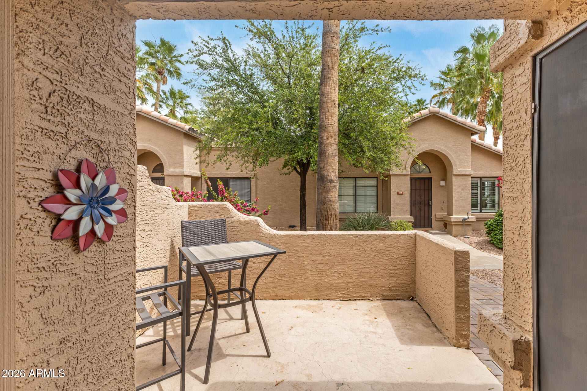 14300 West Bell Road, Unit 311 Surprise, AZ 85374 - Photo 19 of 50 a view of a house with backyard and sitting area