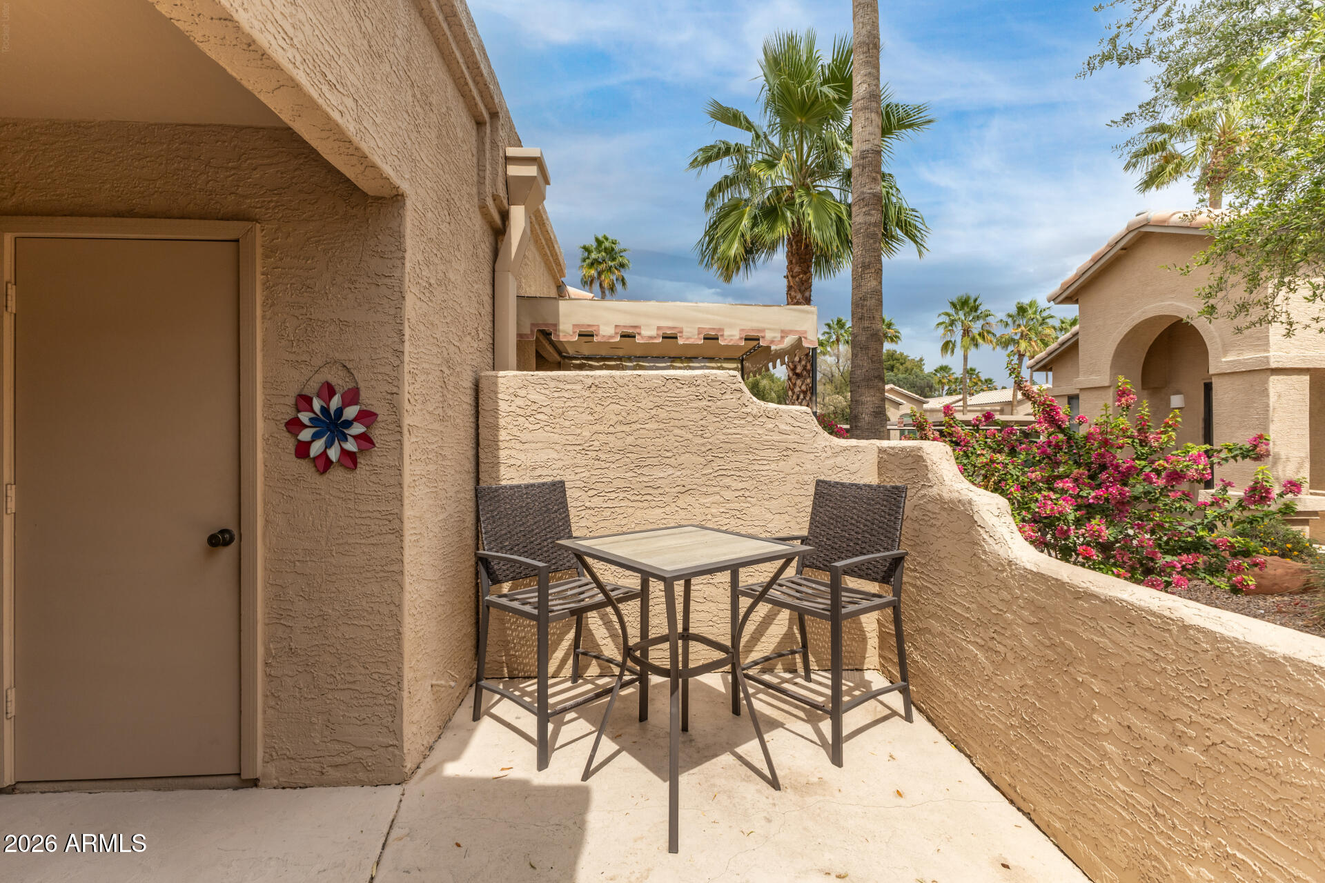 14300 West Bell Road, Unit 311 Surprise, AZ 85374 - Photo 22 of 50 a view of a chairs and table in the balcony
