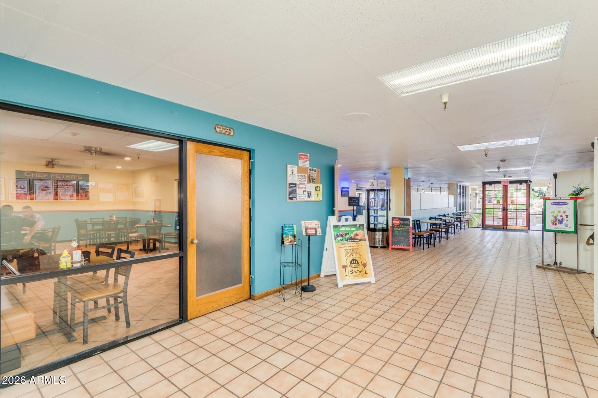 14300 West Bell Road, Unit 311 Surprise, AZ 85374 - Photo 27 of 50 a living room with furniture and a table