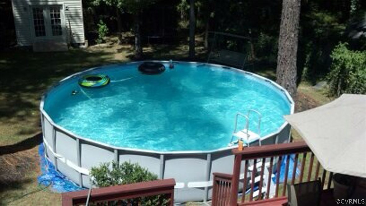 4712 Newbys Bridge Road Chesterfield, VA 23832 - Photo 16 of 17 a backyard of a house with yard and outdoor seating