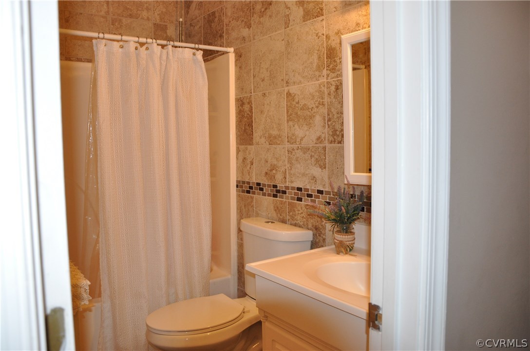 4712 Newbys Bridge Road Chesterfield, VA 23832 - Photo 7 of 17 a bathroom with a sink and toilet