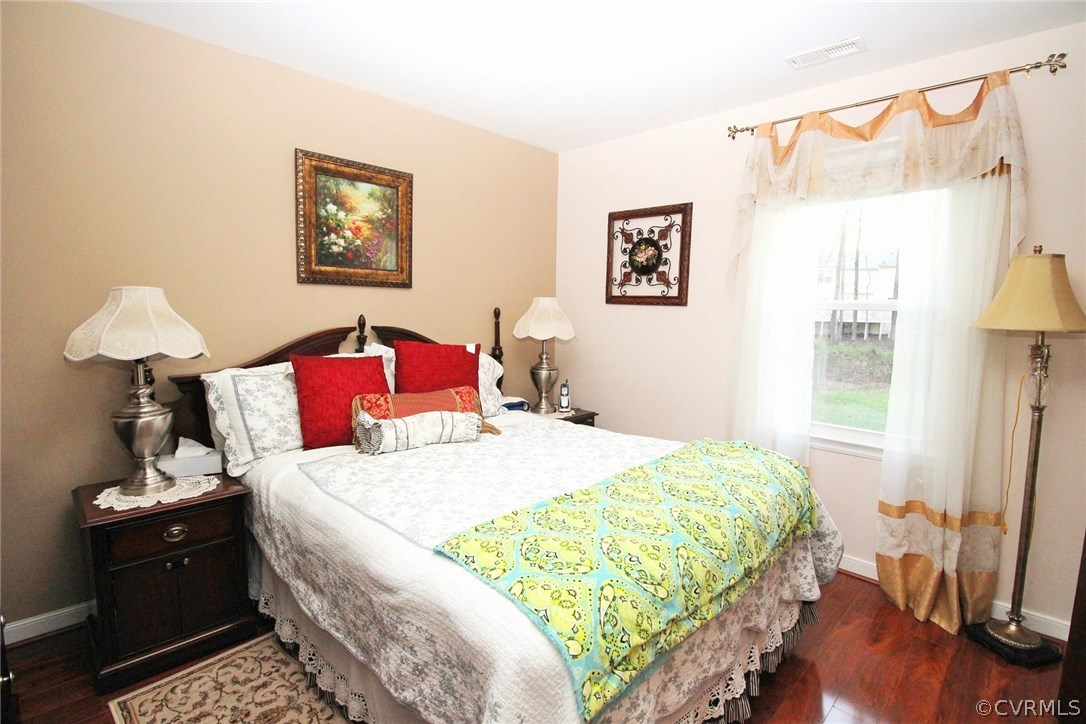 4712 Newbys Bridge Road Chesterfield, VA 23832 - Photo 9 of 17 a bedroom with a bed and a table
