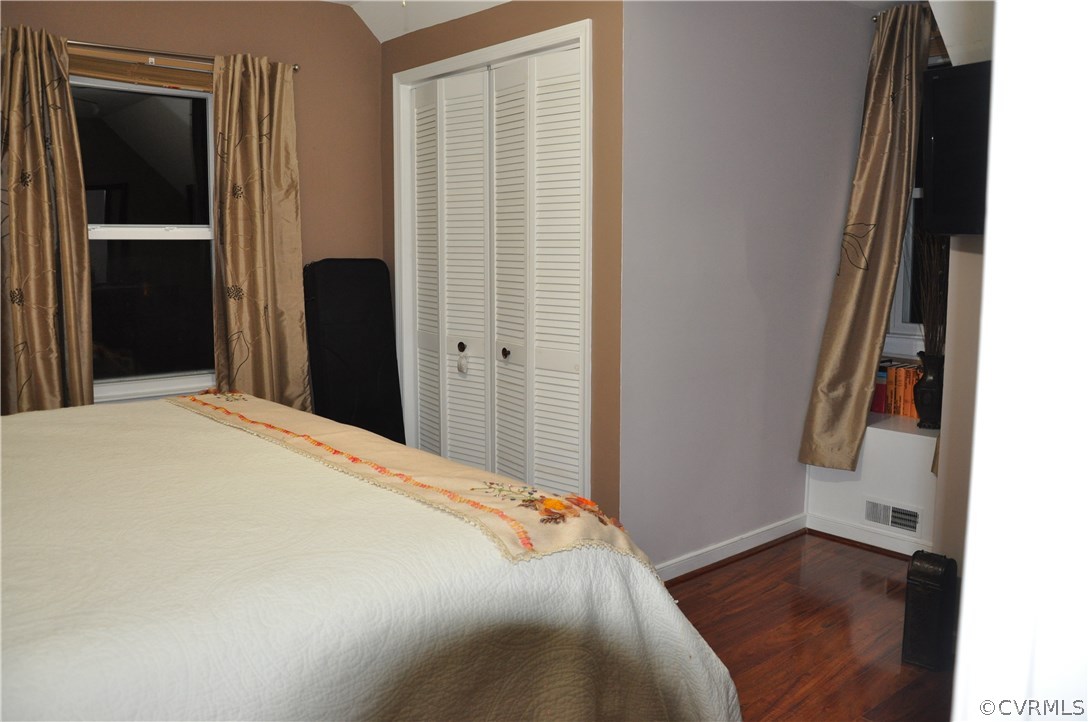 4712 Newbys Bridge Road Chesterfield, VA 23832 - Photo 10 of 17 a bedroom with a bed and wooden floor