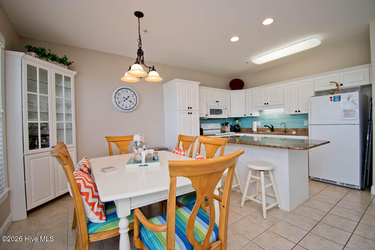 1700 Salter Path Road, Unit 202R Indian Beach, NC 28512 - Photo 11 of 41 Dining to Kitchen view