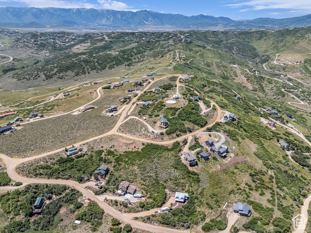 293 Ridge Top Road, Unit 184 Coalville, UT 84017 - Photo 23 of 26 Aerial view of property and surrounding area featuring a mountain backdrop and rural landscape
