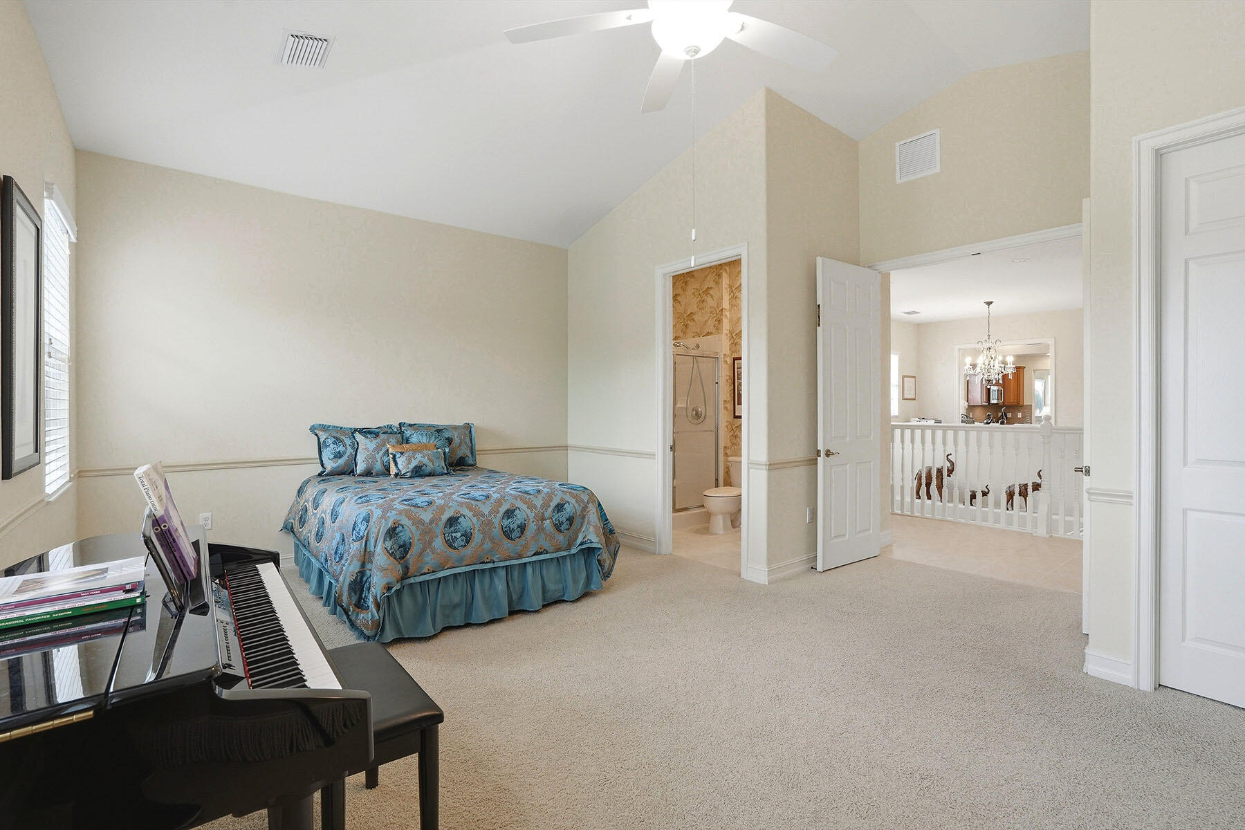 8605 Champions Point, Unit 103 Naples, FL 34113 - Photo 33 of 44 a bedroom with a bed and a table in it