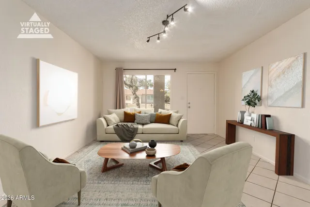 a view of a livingroom with a ceiling fan and wooden floor