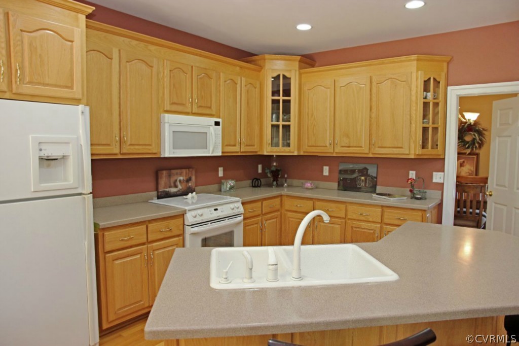 14900 Beach Road Chesterfield, VA 23838 - Photo 11 of 19 a kitchen with a sink cabinets and wooden floor