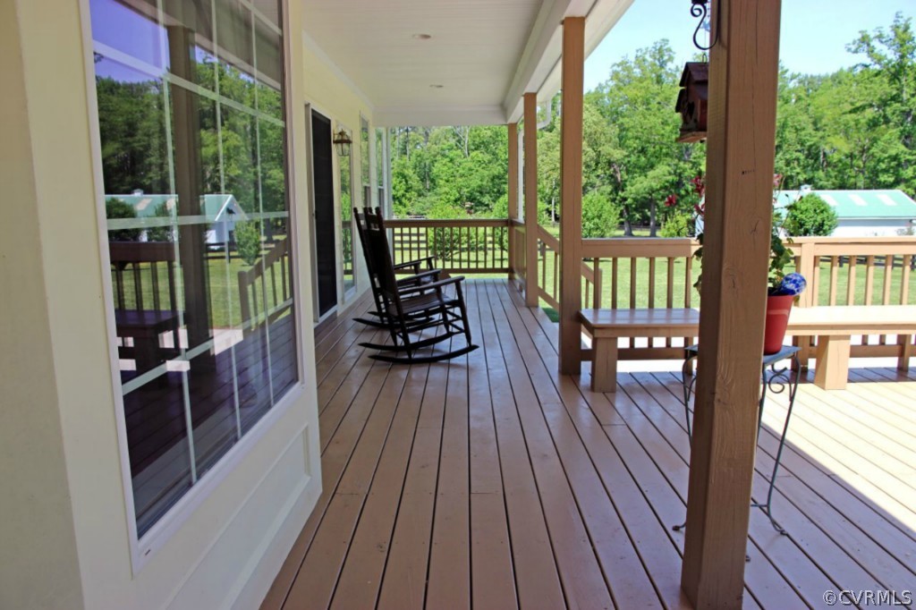 14900 Beach Road Chesterfield, VA 23838 - Photo 3 of 19 a view of a balcony with chairs and wooden floor
