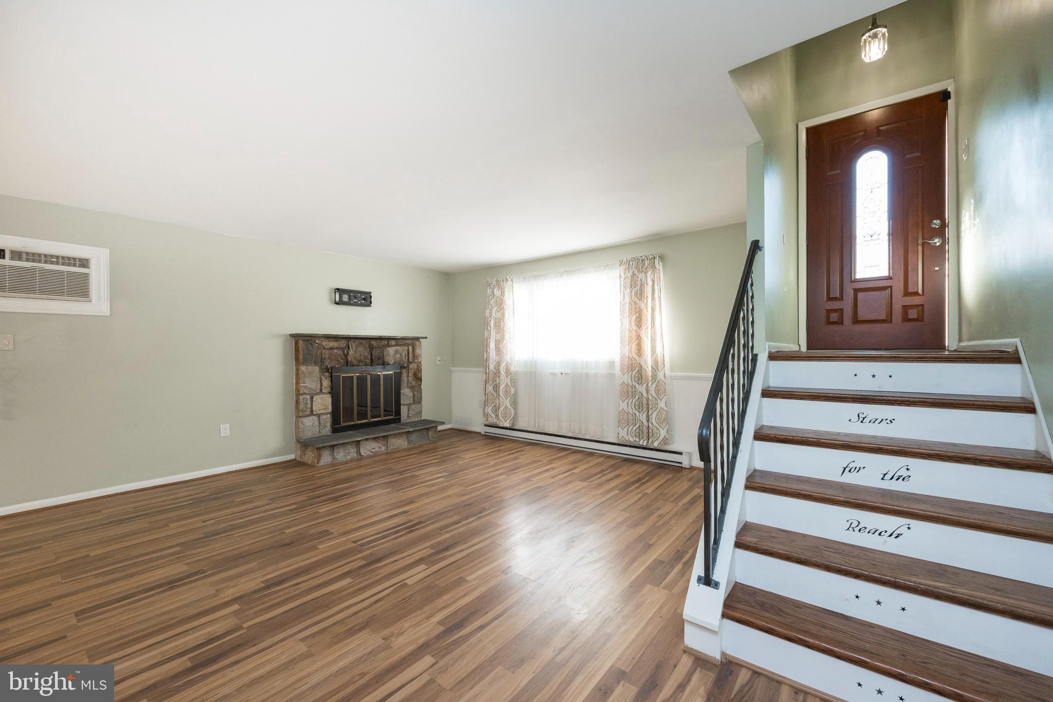 1207 Woodmere Road Pottstown, PA 19464 - Photo 16 of 48 Lower Level Living Room and Entrance