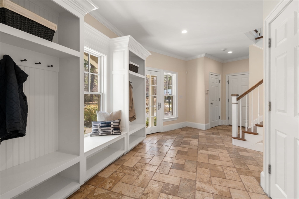 21 Westerly Road Weston, MA 02493 - Photo 13 of 38 a view of a hallway with windows and chandelier