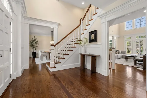 a living room with fireplace furniture and a wooden floor