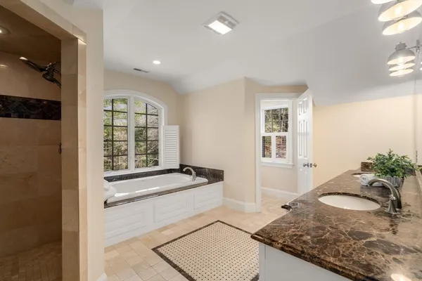 a view of a livingroom with wooden floor and a window