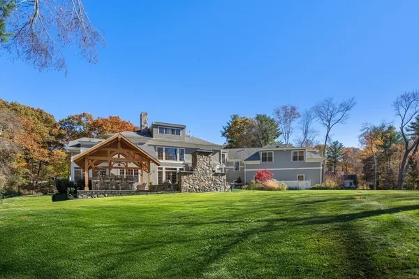 a view of a big house with a big yard