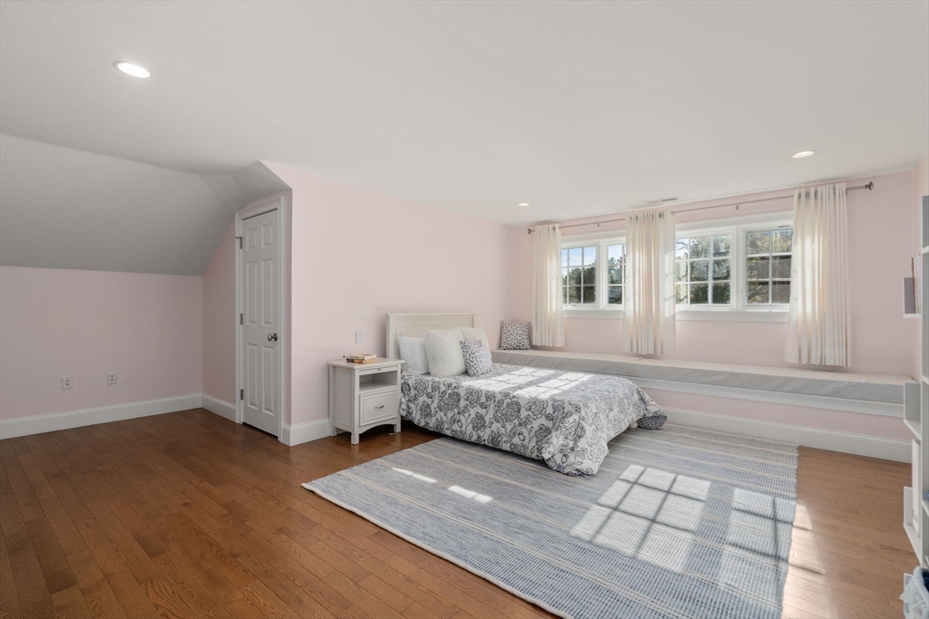 21 Westerly Road Weston, MA 02493 - Photo 27 of 38 a spacious bedroom with a bed and wooden floor