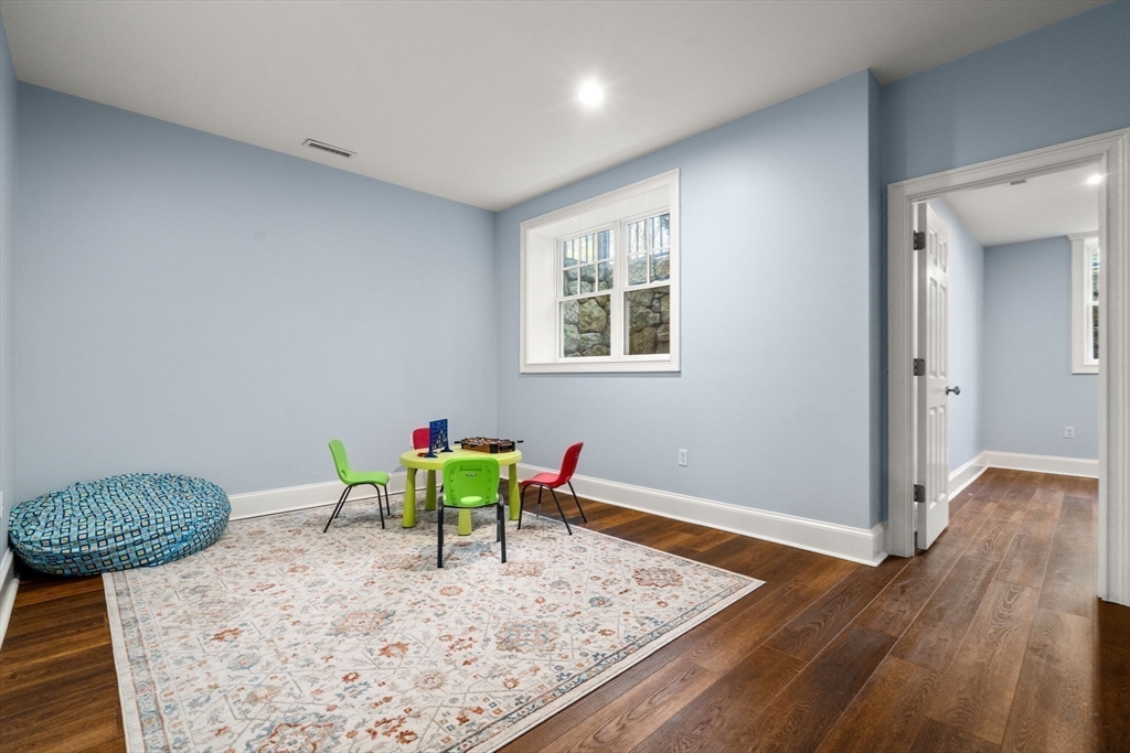 21 Westerly Road Weston, MA 02493 - Photo 30 of 38 a view of a room with wooden floor and furniture
