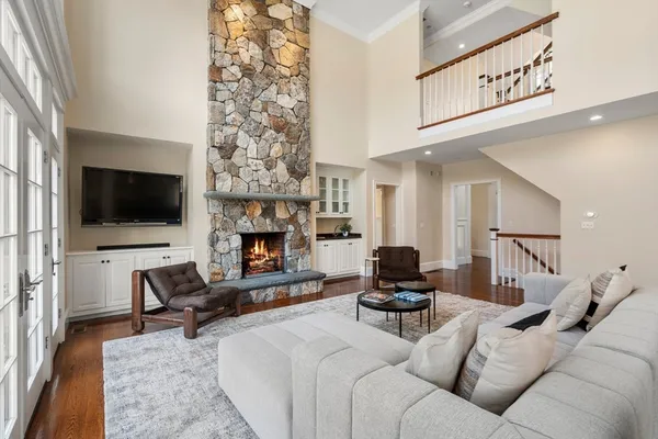 a living room with furniture fireplace and flat screen tv