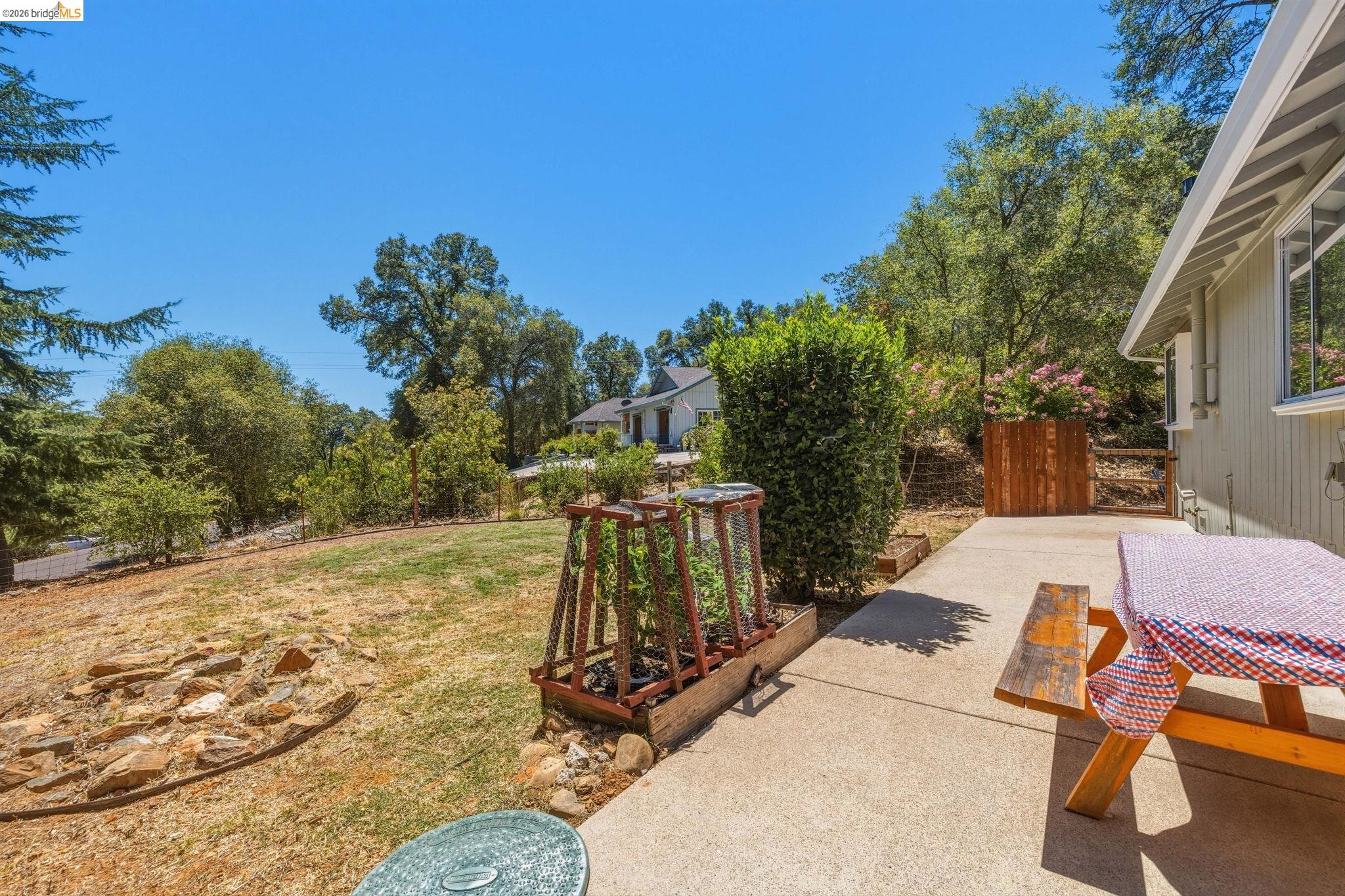 18570 Pradera Real Road Sonora, CA 95370 - Photo 57 of 66 This side yard is great for games, a garden - fenced area for pets and/or kids.