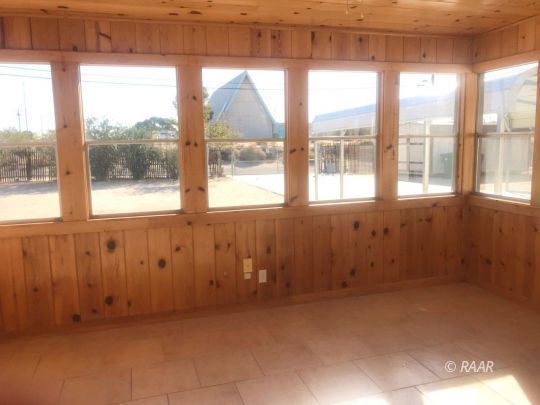 303 West Howell Avenue Ridgecrest, CA 93555 - Photo 7 of 22 a view of an empty room with a window