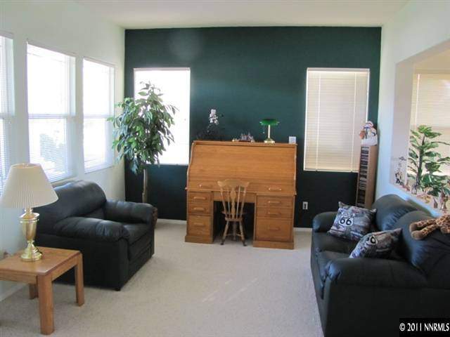 1670 Cattlemen Court Reno, NV 89521 - Photo 2 of 12 a living room with furniture and a fireplace