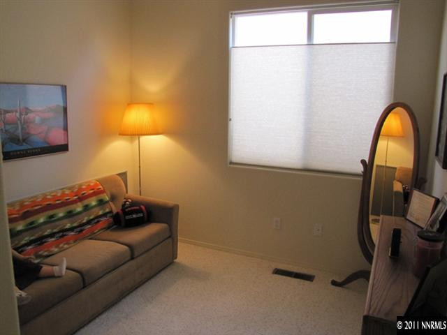 1670 Cattlemen Court Reno, NV 89521 - Photo 5 of 12 a living room with furniture and a lamp