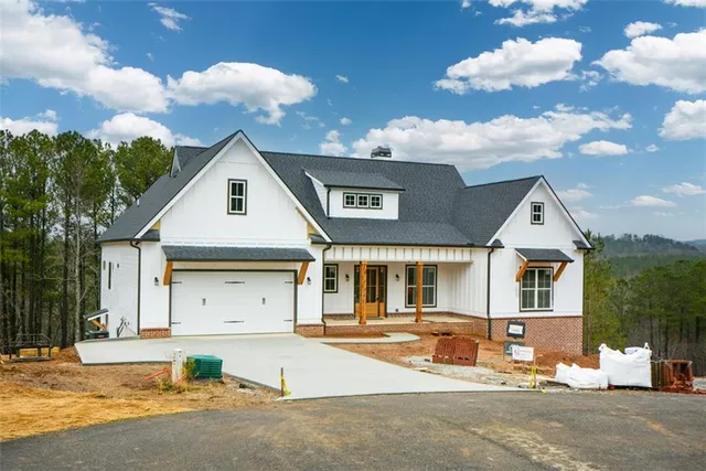 a front view of a house with yard